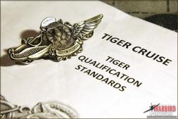 The Tiger Qualification Standards (TQS) Packet and the Tiger Warfare wings given out to all Tigers aboard the USS Abraham Lincoln for the Tiger Cruise 2011. - Photo by the Britt Dietz The Tiger Qualification Standards (TQS) Packet and the Tiger Warfare wings given out to all Tigers aboard the USS Abraham Lincoln for the Tiger Cruise 2011. - Photo by the Britt Dietz
